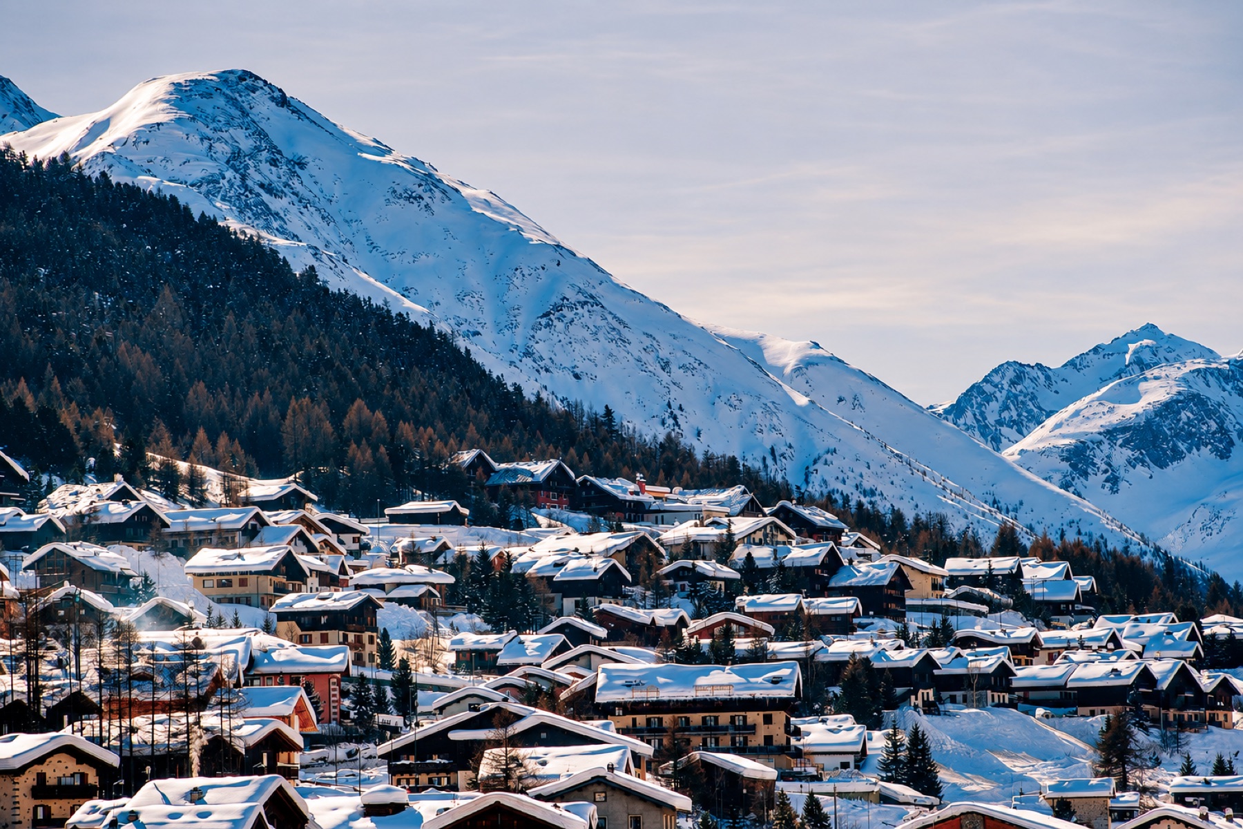 Snow-covered Livigno village beneath the Italian Alps
